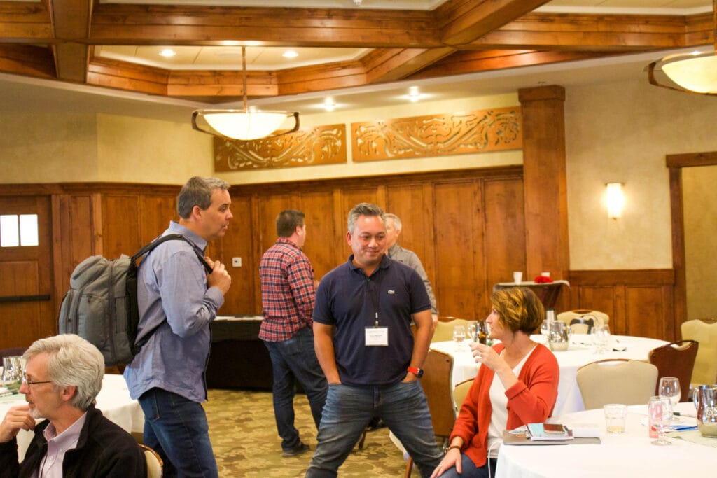 Networking agencycon, a man in a blue shirt with a name tag